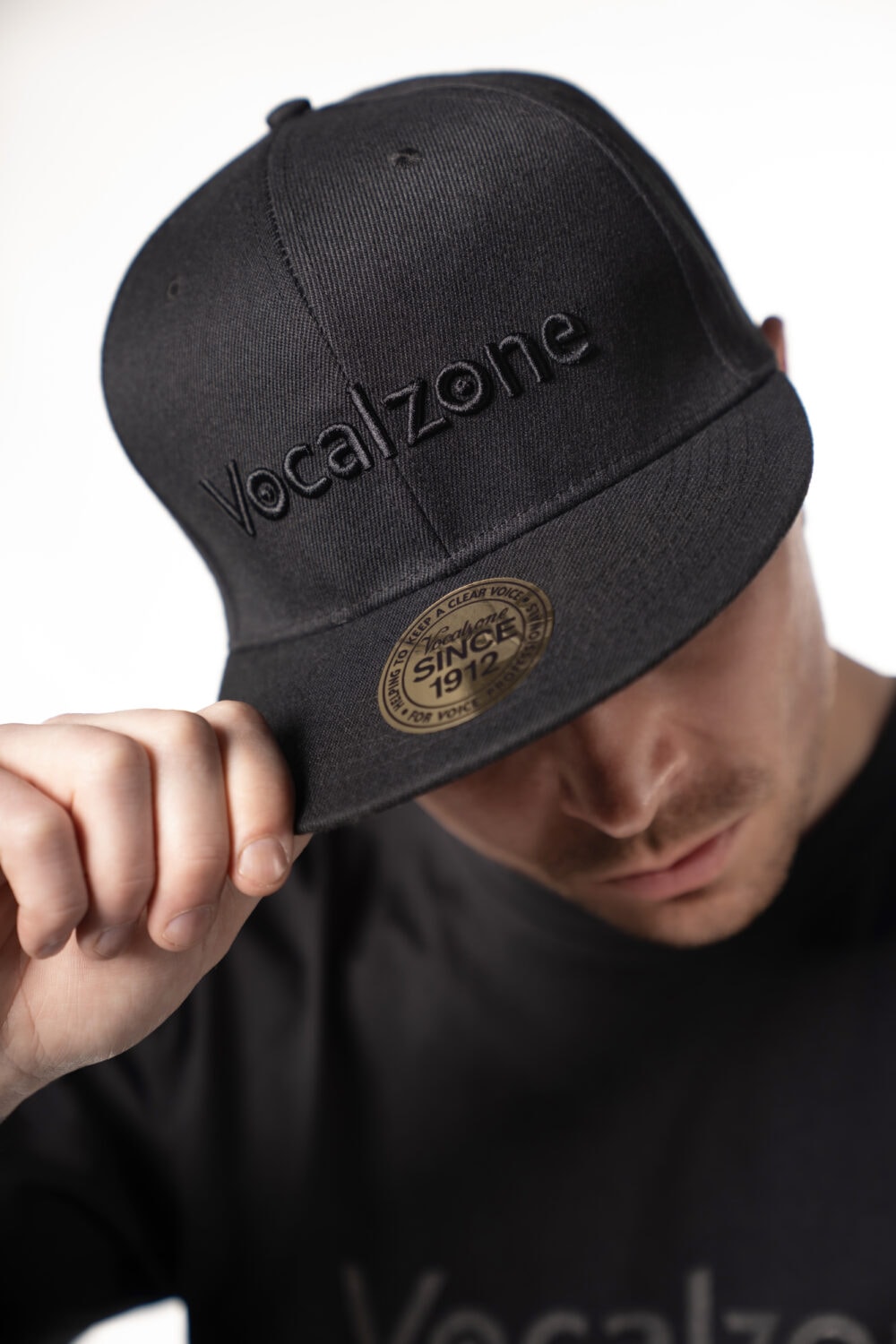Vocalzone Stealth Snapback worn by a male model.