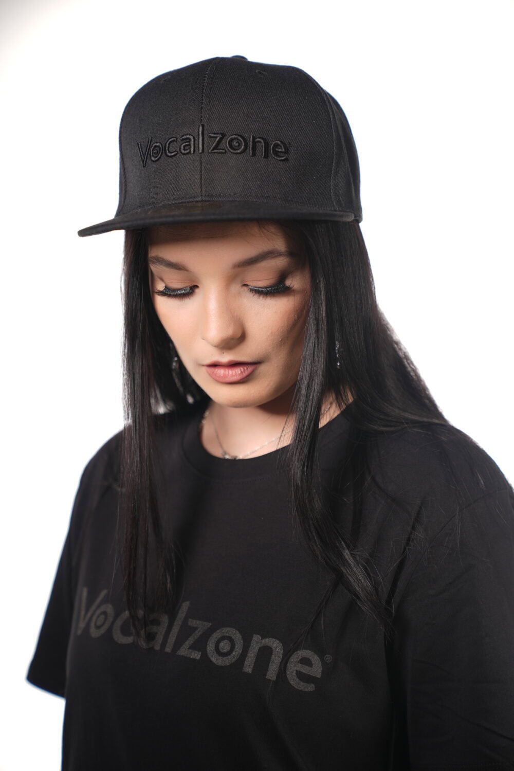 Vocalzone Stealth Snapback worn by a female model.