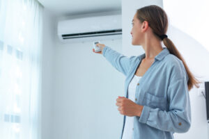 Someone turning on an Air Conditioning unit